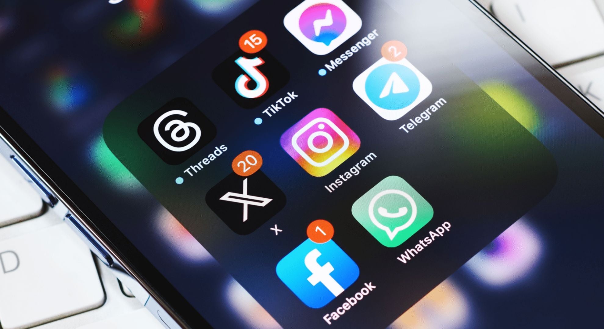 iPhone screen displaying major social media apps including Facebook, TikTok, Instagram, and more, used for promoting auto detailing services