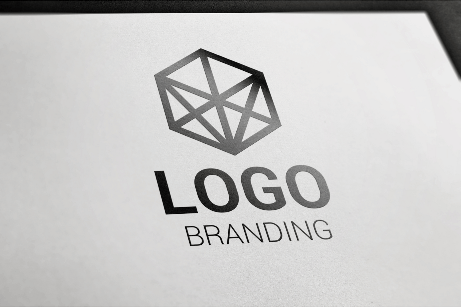 Creative team brainstorming a custom logo design on a digital tablet, symbolizing unique brand identity creation.